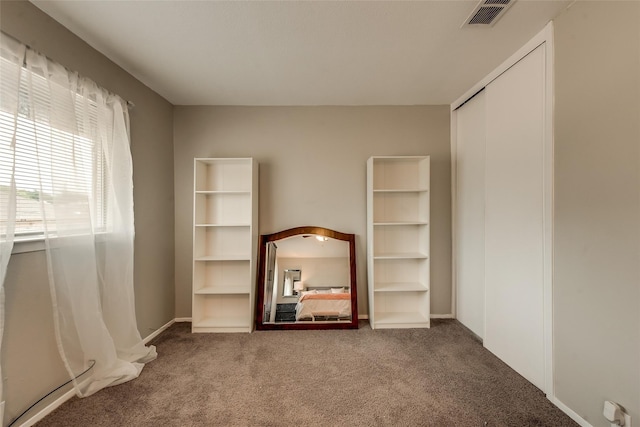 interior space featuring carpet