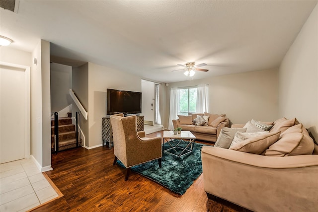 living room with hardwood / wood-style floors and ceiling fan