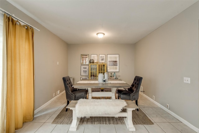 dining area featuring light tile patterned floors