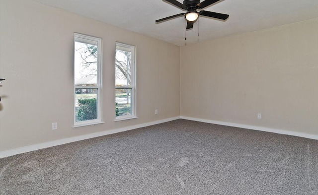 empty room featuring ceiling fan and carpet floors