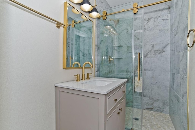 bathroom featuring vanity and a shower with door