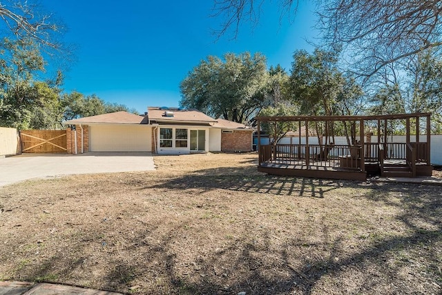 view of yard featuring a garage and a deck