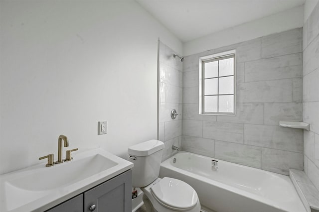 full bathroom featuring vanity, toilet, and tiled shower / bath