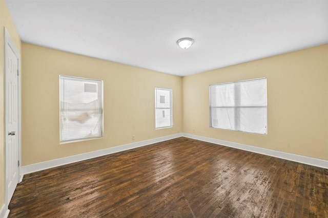 empty room featuring dark hardwood / wood-style floors