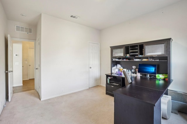 office area featuring light carpet