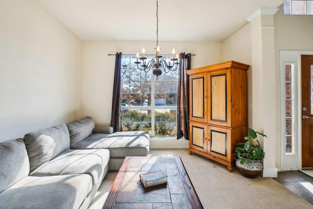 living room featuring light carpet and a notable chandelier