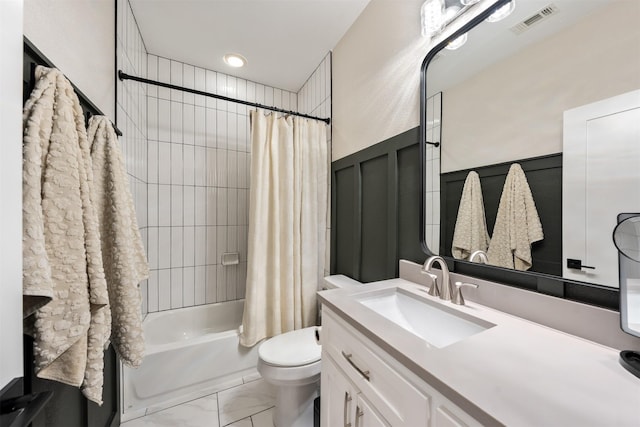 full bathroom featuring shower / bathtub combination with curtain, vanity, and toilet