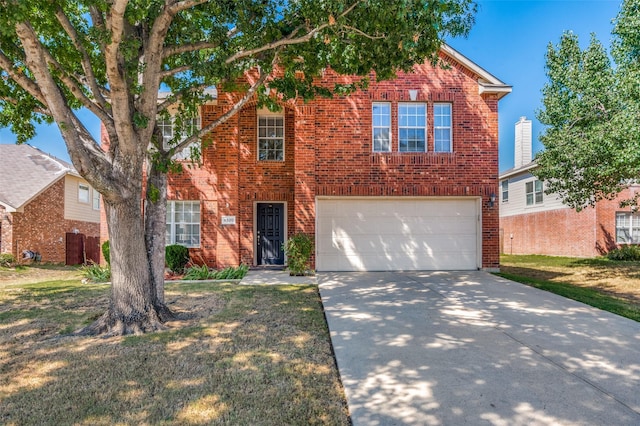 front of property featuring a garage and a front lawn