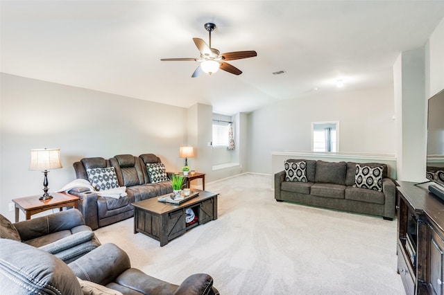 carpeted living room featuring lofted ceiling and ceiling fan