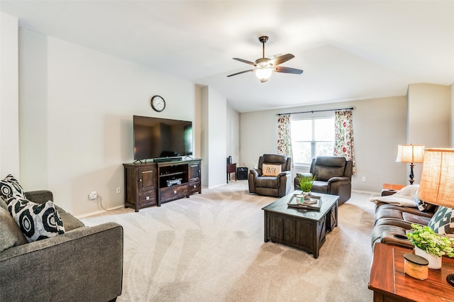 living room with lofted ceiling, light colored carpet, and ceiling fan