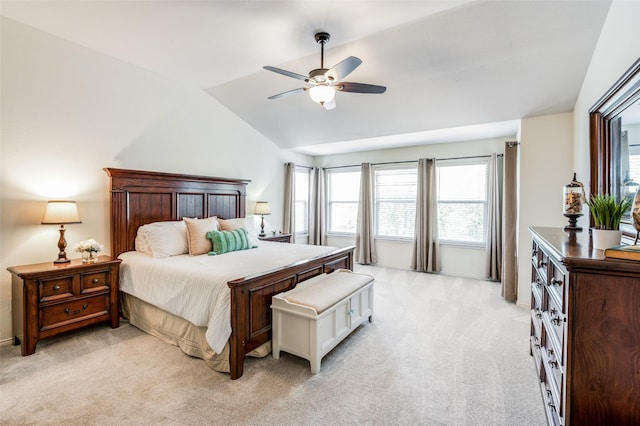 carpeted bedroom featuring lofted ceiling and ceiling fan