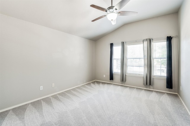 carpeted empty room with lofted ceiling and ceiling fan