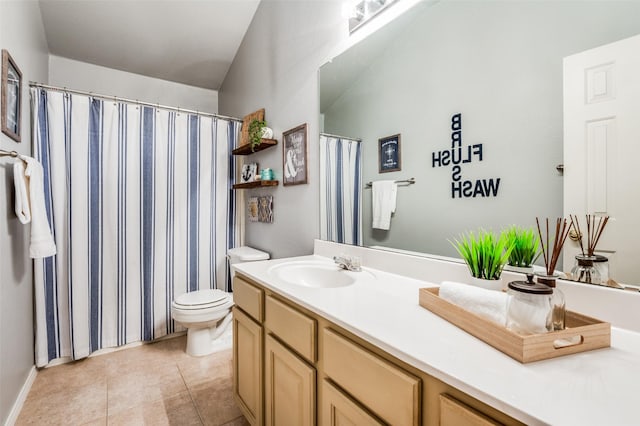 bathroom featuring tile patterned floors, toilet, and vanity