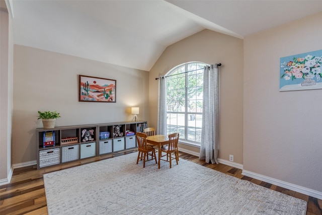 home office with hardwood / wood-style flooring and vaulted ceiling