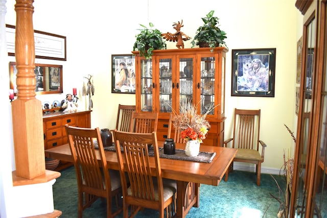 dining space featuring baseboards