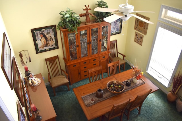 sitting room featuring a ceiling fan and carpet