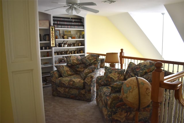 living room with carpet floors, vaulted ceiling, visible vents, and ceiling fan