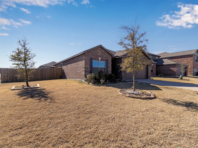 ranch-style home featuring a garage and a front lawn