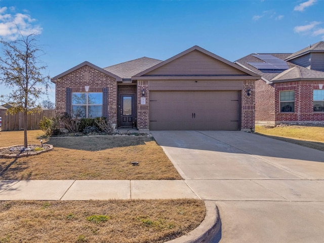 view of front of home featuring a garage and a front lawn