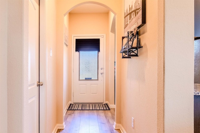 entryway with hardwood / wood-style floors