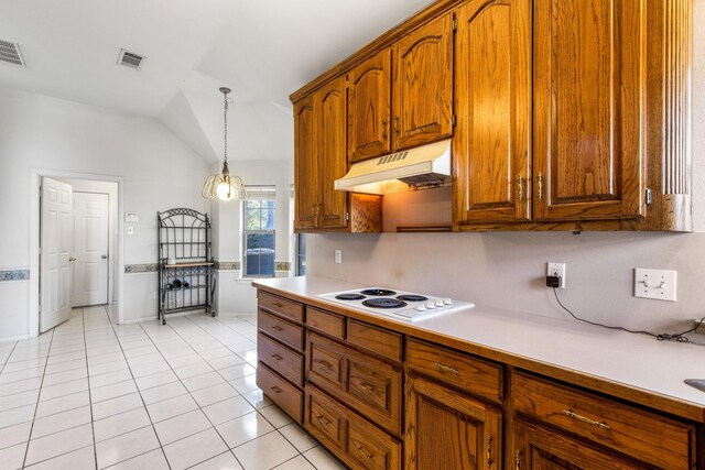 kitchen with dishwasher, white electric cooktop, sink, and light tile patterned floors