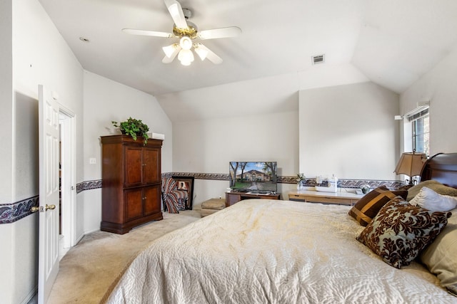 bedroom with lofted ceiling, light carpet, and ceiling fan