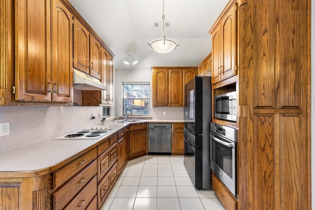 kitchen with stainless steel appliances, light tile patterned flooring, sink, and pendant lighting