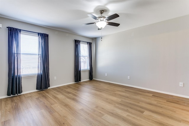 unfurnished room featuring ceiling fan and light hardwood / wood-style flooring