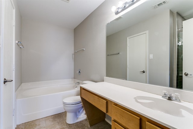 bathroom featuring vanity, a tub, tile patterned floors, and toilet