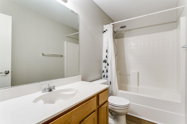 full bathroom featuring hardwood / wood-style flooring, vanity, toilet, and shower / bath combo with shower curtain