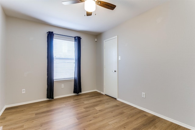 unfurnished room featuring ceiling fan and light hardwood / wood-style floors