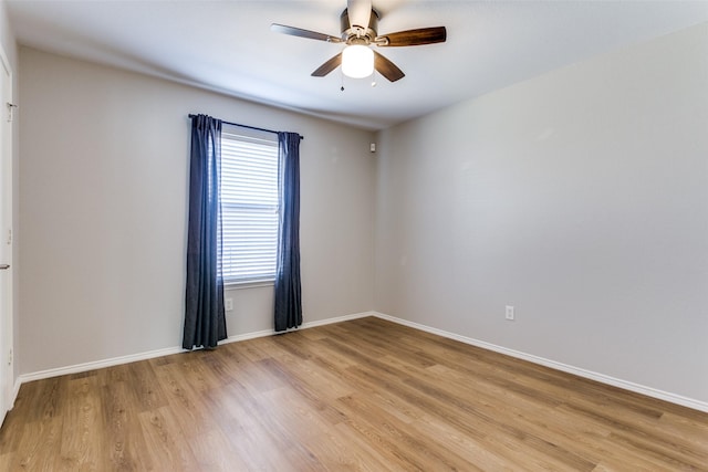 unfurnished room featuring ceiling fan and light hardwood / wood-style floors