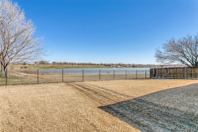 view of yard featuring a rural view and a water view