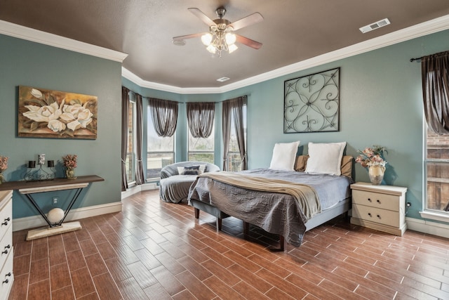 bedroom with ornamental molding and ceiling fan