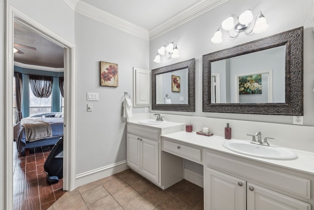 bathroom featuring tile patterned flooring, vanity, and ornamental molding