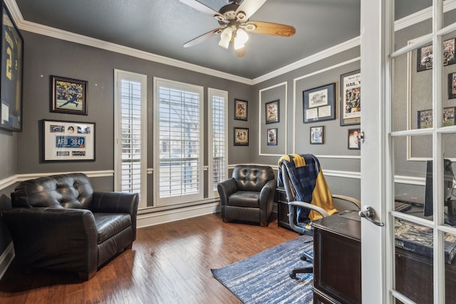 office space with crown molding, dark wood-type flooring, and ceiling fan