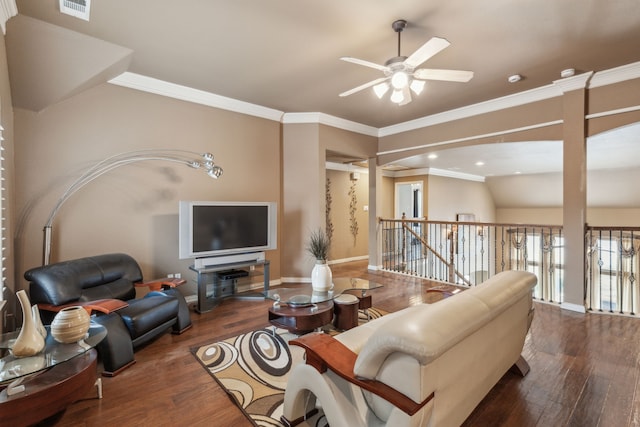 living room featuring crown molding, dark wood-type flooring, ceiling fan, and vaulted ceiling