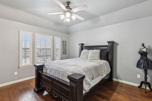 bedroom with ceiling fan, dark hardwood / wood-style floors, and vaulted ceiling