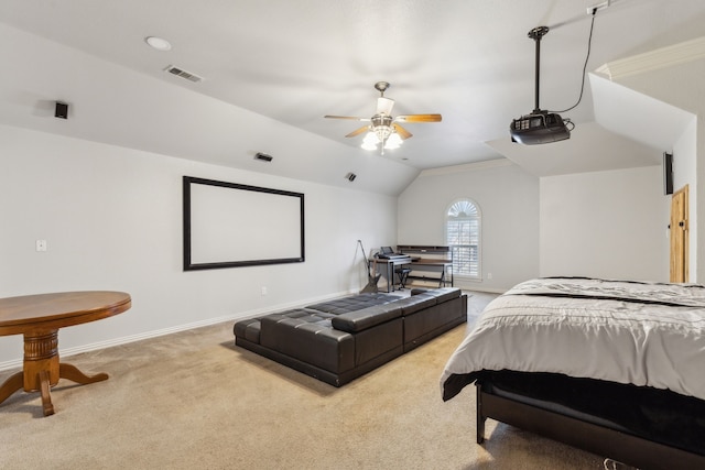 carpeted bedroom with crown molding, lofted ceiling, and ceiling fan