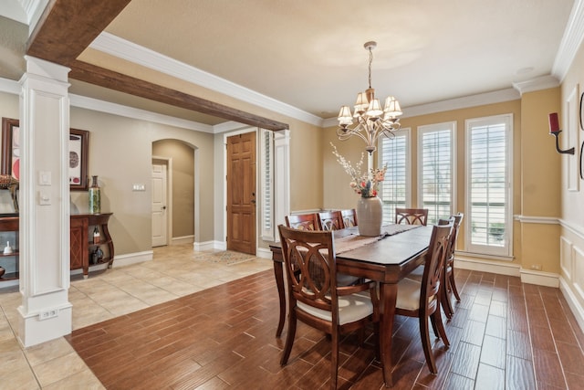 tiled dining area featuring ornate columns, ornamental molding, and a healthy amount of sunlight