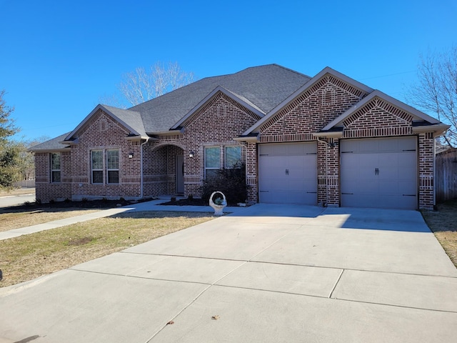 ranch-style house featuring a garage