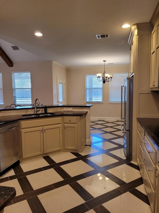 kitchen featuring sink, decorative light fixtures, refrigerator, dishwasher, and a notable chandelier