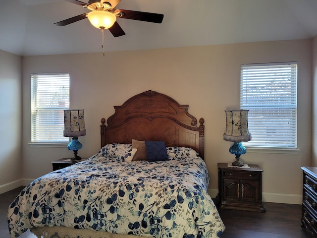 bedroom with dark hardwood / wood-style floors and ceiling fan