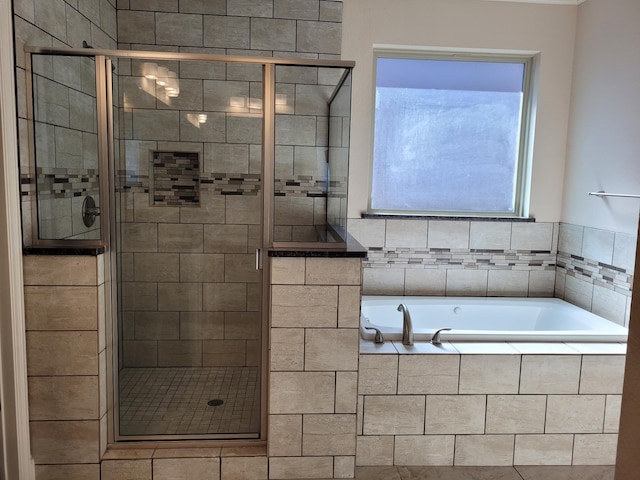 bathroom with separate shower and tub