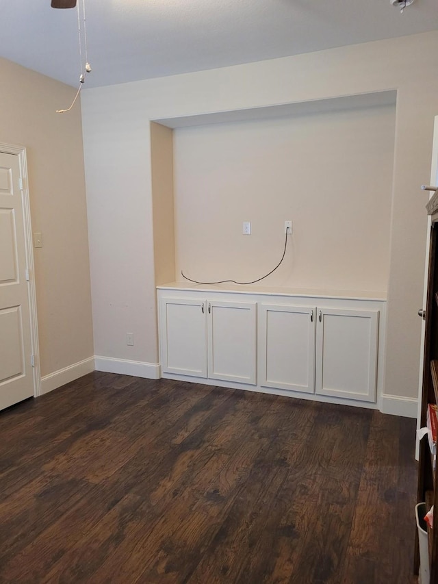 spare room with dark hardwood / wood-style flooring