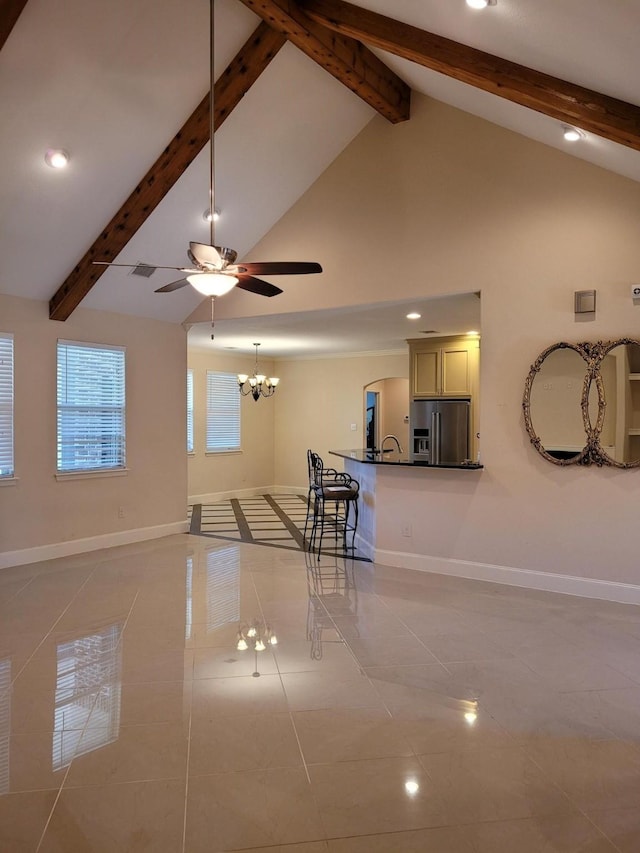 unfurnished living room with light tile patterned flooring, high vaulted ceiling, beam ceiling, and ceiling fan with notable chandelier