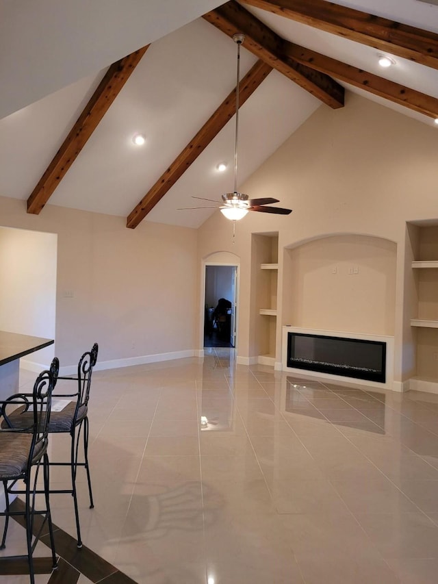 tiled living room with vaulted ceiling with beams, built in features, and ceiling fan