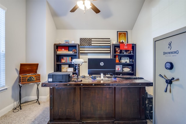 carpeted home office with vaulted ceiling and ceiling fan