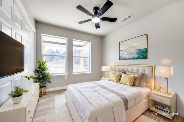 bedroom featuring ceiling fan and light hardwood / wood-style flooring