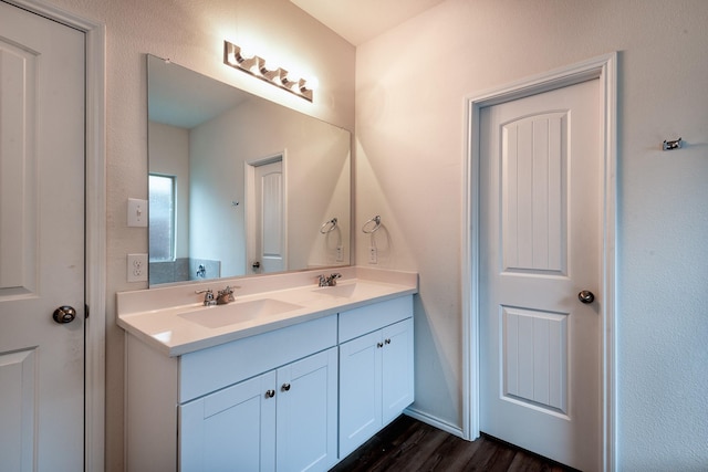 bathroom featuring vanity and wood-type flooring